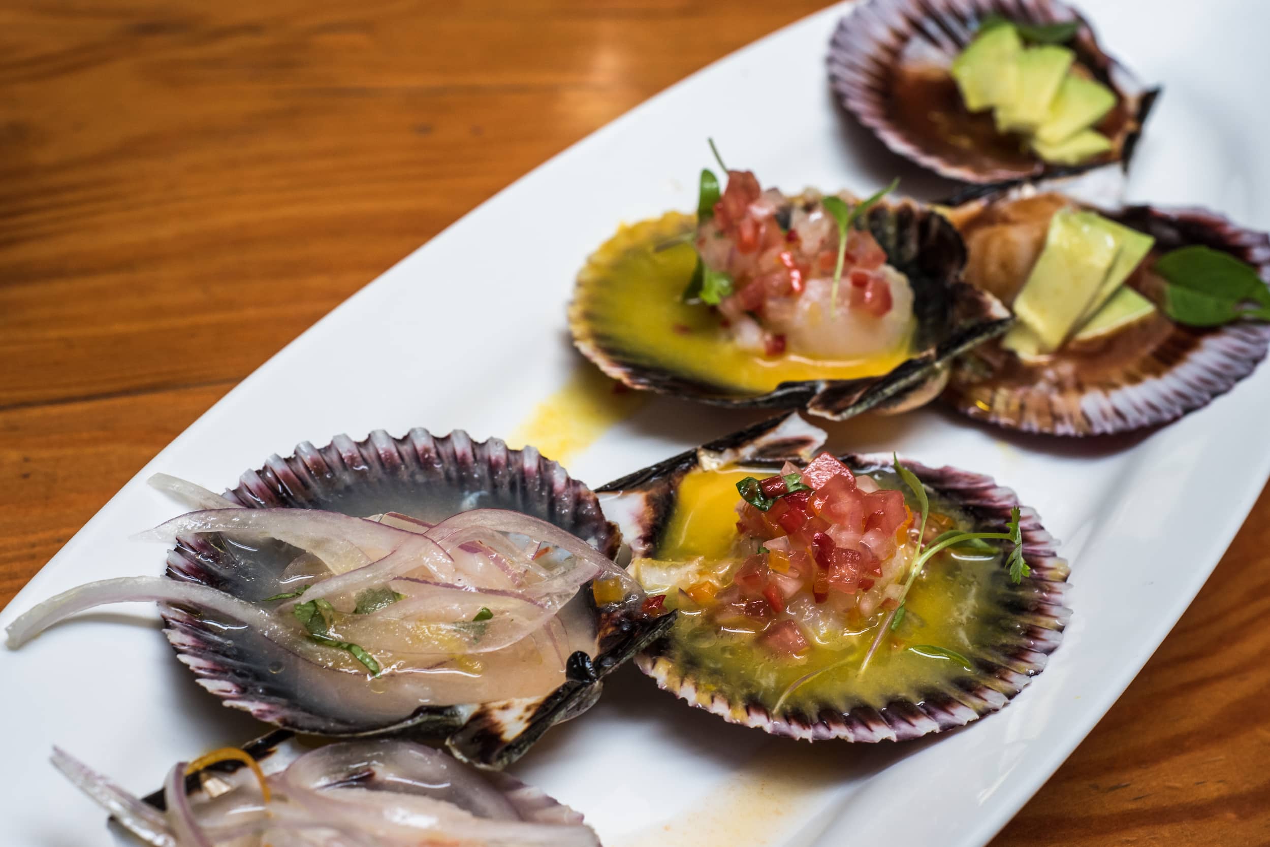 Peruvian scallop ceviche served in half shells, high-end dining in Lima