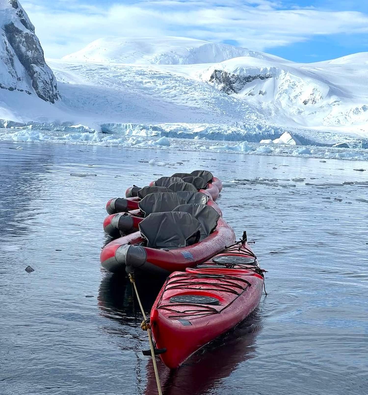 Kayaks ready for an icy adventure.