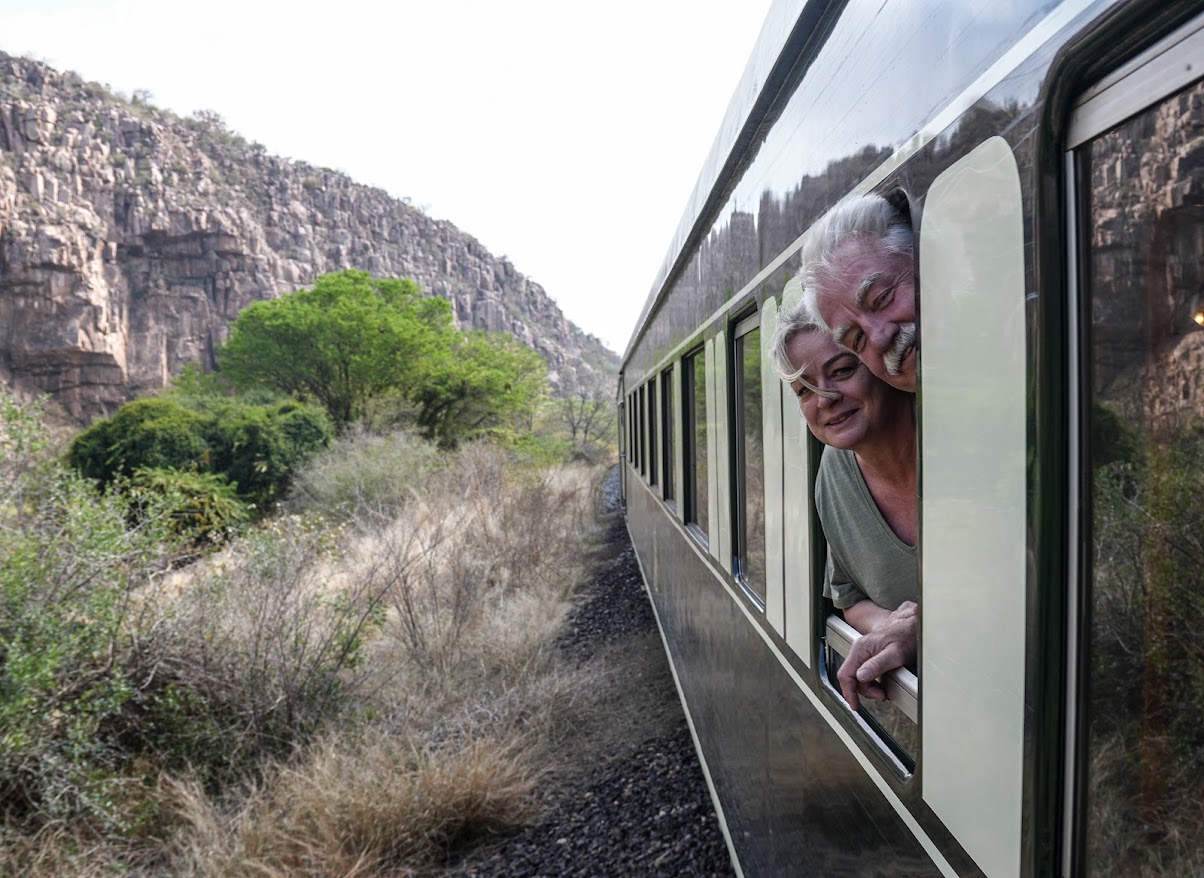 Taking in the views aboard the Rovos Rail. Taking in the views aboard the Rovos Rail.