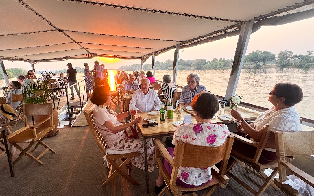 Viva guests enjoying the tour, including the sunset during a boat cruise.