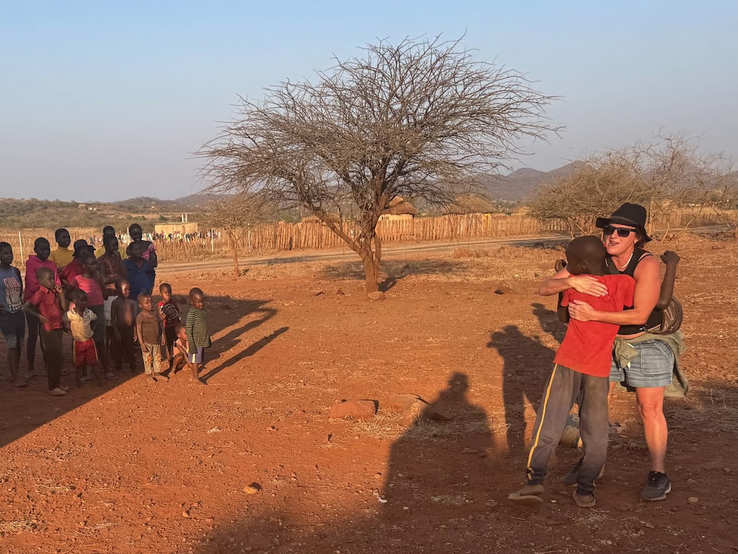 Rachel and a few passengers joined a spontaneous soccer game with local kids at Great Zimbabwe.