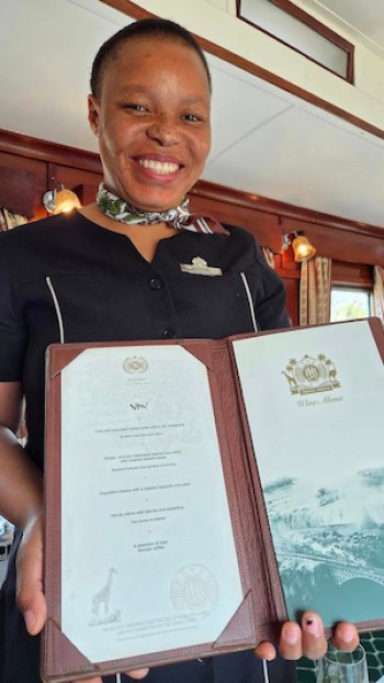 Joyce sharing the day’s menu aboard Rovos Rail.