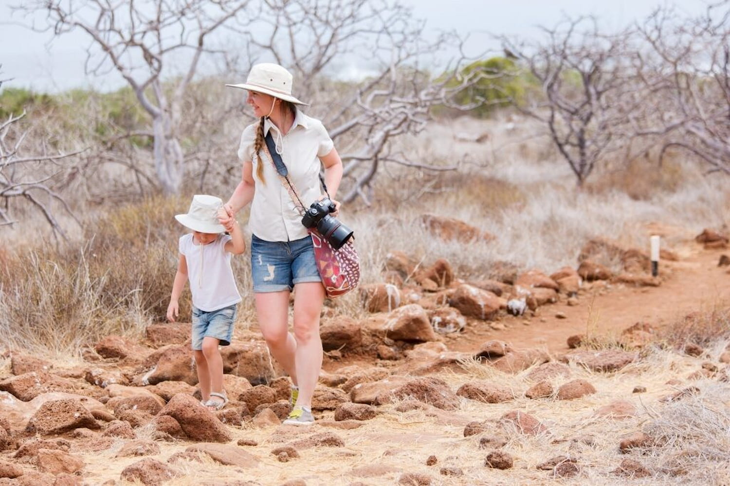 Mother and daughter hiking at North Seymour, Galapagos Islands.