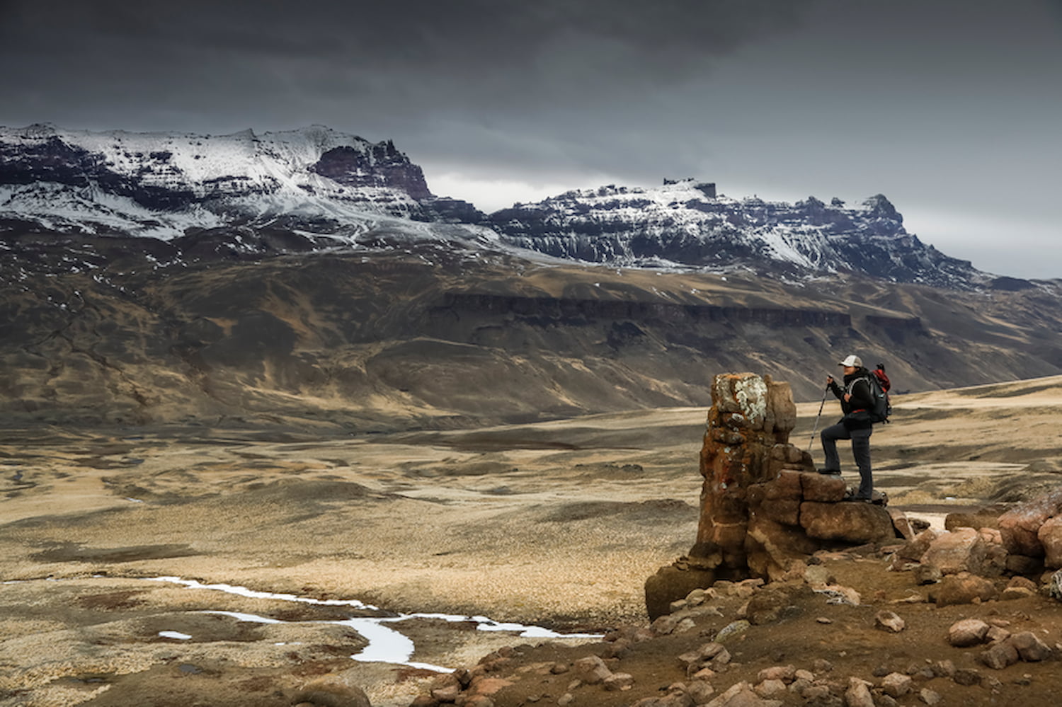 Wide open valley with hiker on a trail in Patagonia.