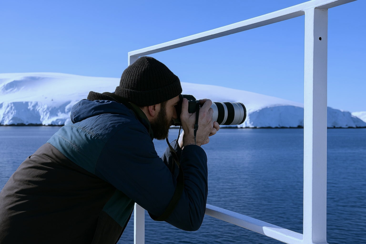 Passenger photographing scenery on a polar expedition cruise