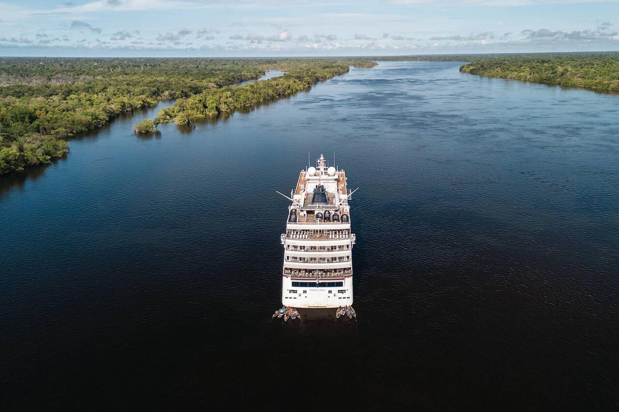 Hanseatic river cruise ship navigating a channel in the Amazon Rainforest.