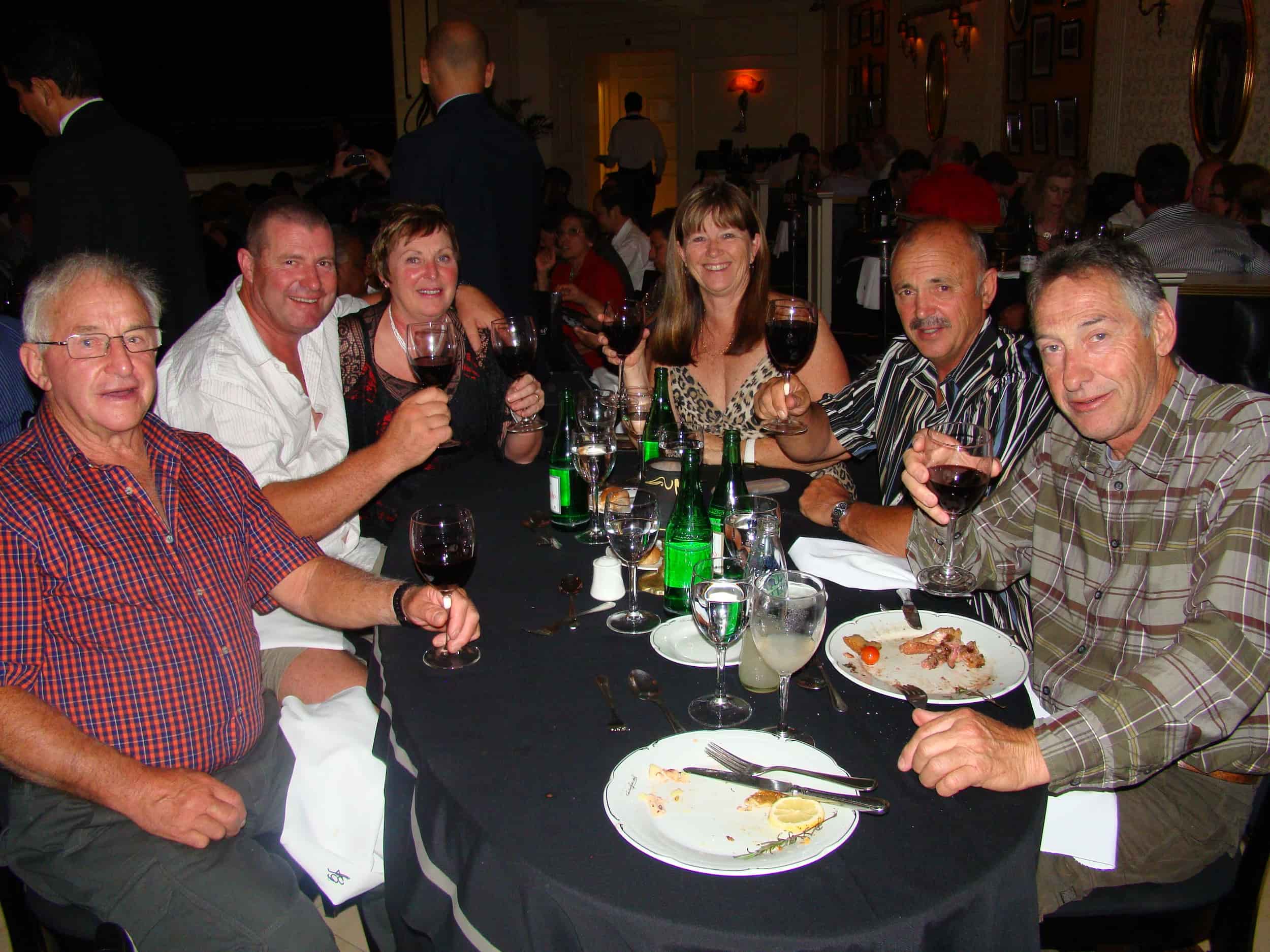 Group of people enjoying dinner at a restaurant in Argentina.