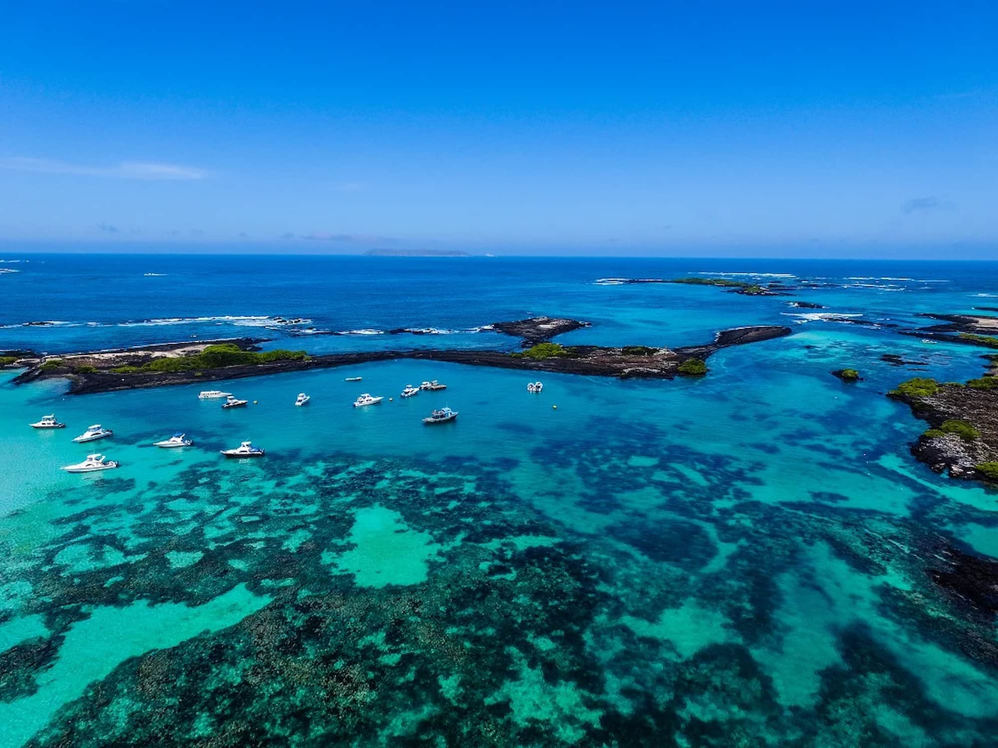 Small cruise ships sailing off San Cristóbal Island